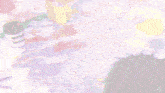a blurred image of a person with a purple haircut