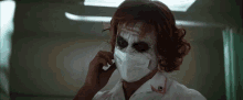 Heath Ledger Mask GIF - Heath Ledger Mask Joker GIFs