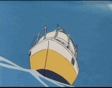 a yellow orange and blue sail against a blue sky