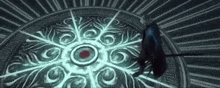 a man with a sword is standing in front of a circle with a red center .