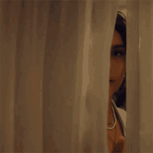 Peeking Sofia Camara GIF - Peeking Sofia Camara Never Be Yours Song GIFs