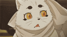 a close up of a cat with orange eyes
