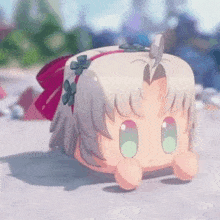 a cartoon character with a headband and a bow on her head is sitting on the ground .