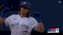 a blue jays player celebrates a home run