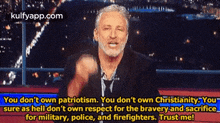 a man with a beard is giving a speech on a television show about patriotism and christianity