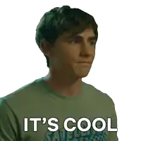 a man wearing a green shirt that says it 's cool on it