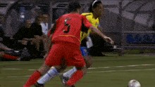 soccer players on a field with one wearing a yellow shirt with the number 17 on it