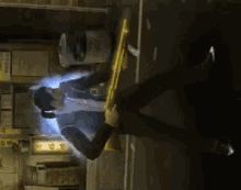 a man is falling down while holding a sword in his hand