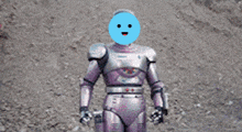 a close up of a purple robot 's arm with a blue sky in the background .
