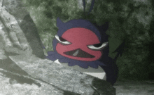 a black and red cartoon character with a devil 's face is sitting on a rock .