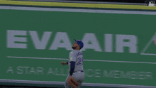 a baseball player in a blue jays uniform throws the ball