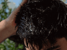 a close up of a man 's face with water coming out of his nose