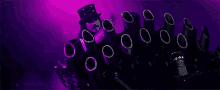 a purple and black object with the words faces stacked within