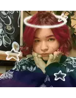 a girl with red hair is wearing a sweater and has a halo on her head