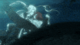 a man and a woman are swimming in the water