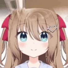 a close up of a girl with long brown hair and blue eyes with a heart shaped hair clip .