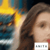 a blurry picture of a woman with the name anita on the bottom right