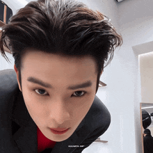 a close up of a man 's face with the words khunpol gif on the bottom