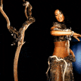 a woman holding a snake around her neck