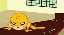 a cartoon monkey is laying on the floor with a broken glass