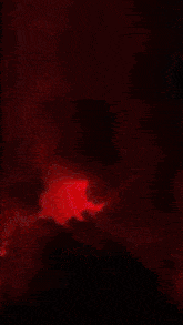 a red lightning bolt strikes a person in a dark room
