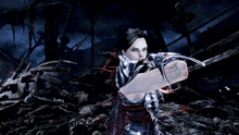 a woman in a video game is holding a sword in her hand