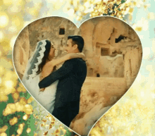 a bride and groom are dancing in a heart shaped frame