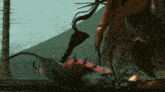 a computer generated image of a monster with sharp claws eating another monster