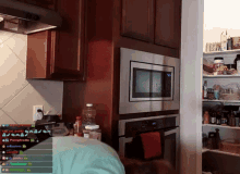 a kitchen with a stainless steel microwave and a few shelves with bottles on them