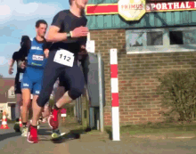 Runner Smashes Nuts Into Pole Runner GIF