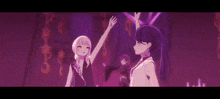 a group of anime girls are standing next to each other on a stage .