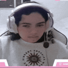 a woman wearing headphones and a shirt that says ' freedom '