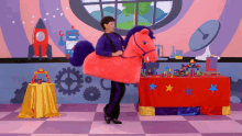 Mascot Horse Ride GIF - Mascot Horse Ride Pink Horse GIFs