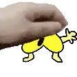 a hand is holding a yellow cartoon dog .