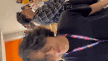 a man with a lanyard around his neck that says ' philippines ' on it