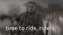 a man in a suit is sitting in a chair with the words time to ride riders below him