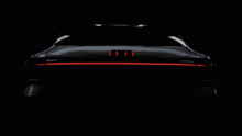 the audi logo is surrounded by sparkles on a dark background