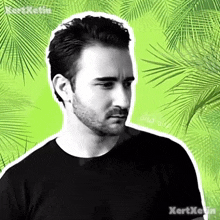 a man with a beard is wearing a black shirt with a green background .