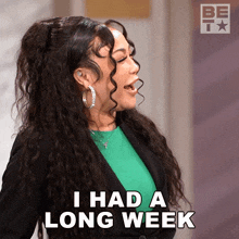 a woman says i had a long week in front of a be tv logo