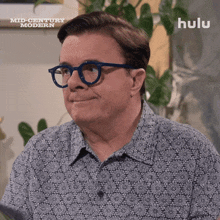 a man wearing glasses and a shirt that says hulu