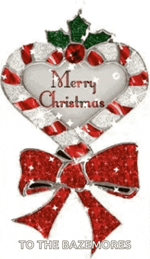 a candy cane in the shape of a heart with a bow and holly and the words `` merry christmas '' on it .