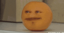 an apple with a face on it is sitting on a table
