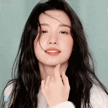 a close up of a woman with long black hair