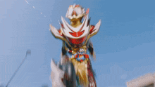 a man in a superhero costume is standing in front of a building