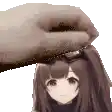 a hand is putting a doll 's head on a white background .