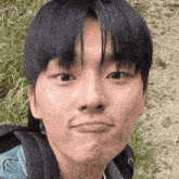 a close up of a young man making a face