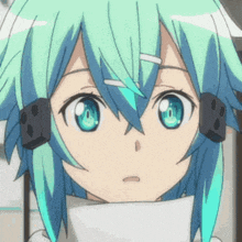 a close up of a girl 's face with blue hair and headphones .