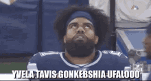 a man with a beard is wearing a jersey that says nfl on it