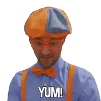 a man in a blue shirt and orange suspenders is saying yum