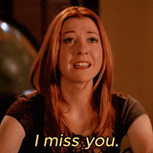 a woman with red hair is crying and the words i miss you are next to her